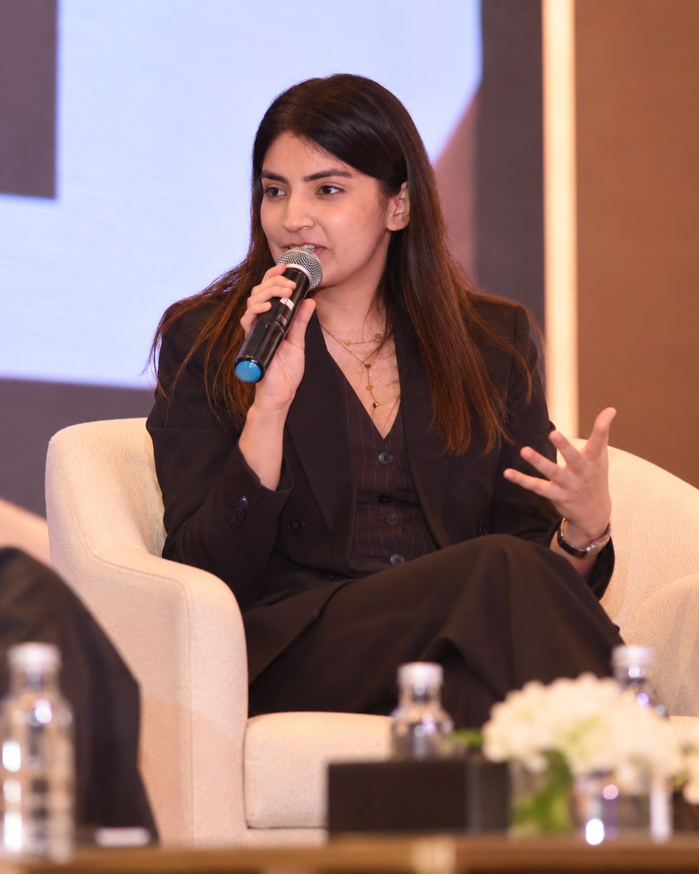 Meghana Chandani speaking on stage